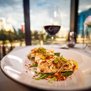 a plate of food and a glass of wine