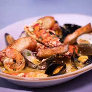 a bowl of seafood and clams