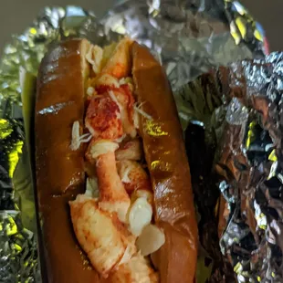 a lobster roll wrapped in foil