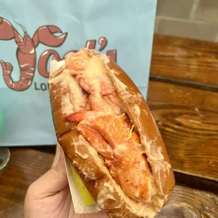 Hot lobster roll with bisque drizzle