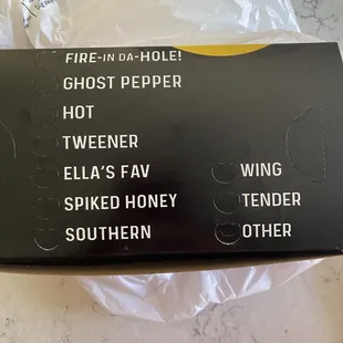 Takeout boxes identify several of the available options for a custom order.