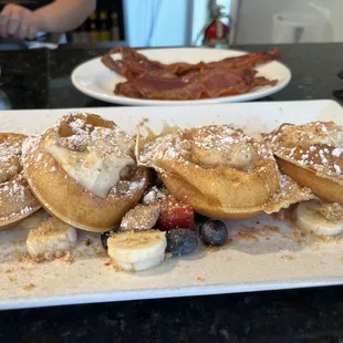 Excellent Belgian waffles , fruit, strudel, side bacon