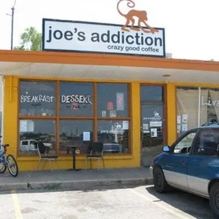 a car parked in front of a restaurant