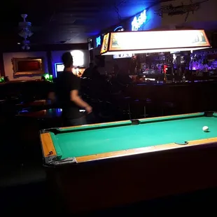 Profile. Dark and divey= unpretentious.