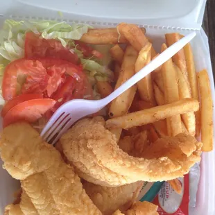 a meal in a styrofoam container