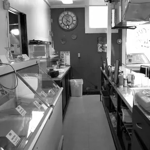 a black and white photo of a kitchen