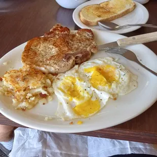 Pork chop breakfast plate (after eating 1/2 the potatoes &amp; toast.)