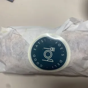 a burrito wrapped in paper