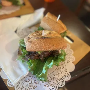 a sandwich with lettuce and meat