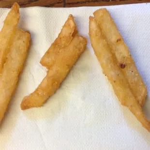 &quot;Seasoned&quot; fries, but they taste plain. A majority of ours were fused together.