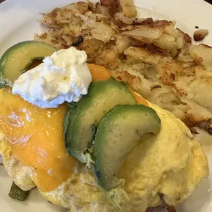 Mexican Chicken Fajita Omelette with cheese, avocado, &amp; sour cream.