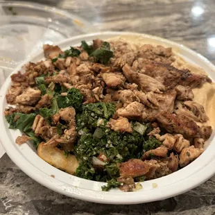 Chicken Shawarma with spicy hummus, tabbouleh, banana peppers