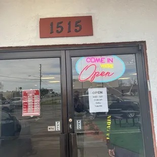 Hours in front entrance