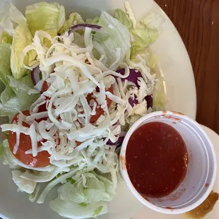 Side salad with a marinara vinaigrette dressing