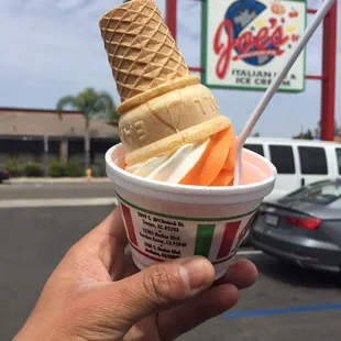 Orange cream twist and I cup with the cone on top. How life is meant to be