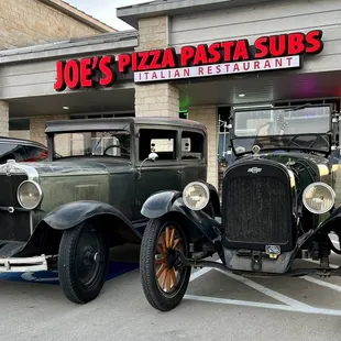 ld cars parked in front of the restaurant