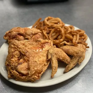 4 piece chicken dinner with a side of haystacks