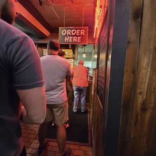 Look at this ridiculously long line which actually wrapped back to the entrance and only one cashier!  craziness!