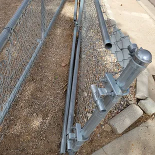 Broken fence after drive bent it back as far as he could