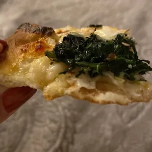 The perfect crust - spinach is cooked just right, not burnt like other places. Delish!