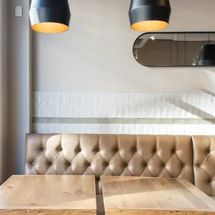 a booth with a table and chairs