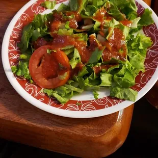 Dinner salad with tomato basil dressing