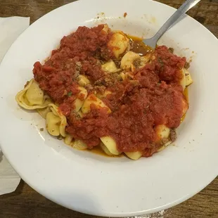 a plate of pasta and sauce