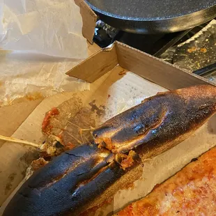 a slice of pizza in a box