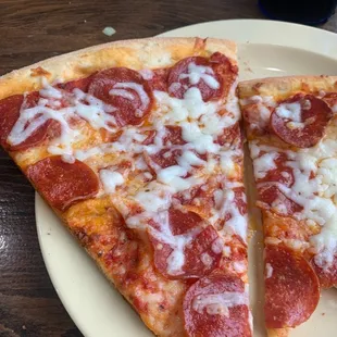 two slices of pepperoni pizza