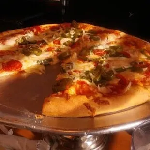 Pepperoni and Jalapeño oven-baked pizza, with one slice already eaten haha.