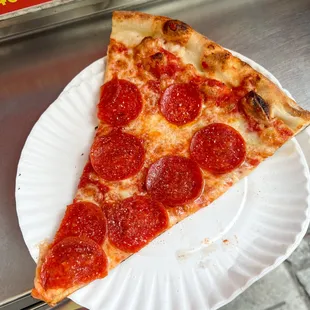 a slice of pepperoni pizza