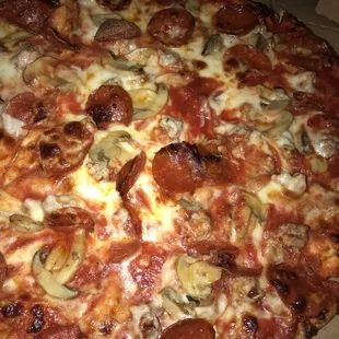 This is sausage pepperoni mushroom, thin crust, well done, double sauce, double cheese.   This is how you get an old school joes pizza.