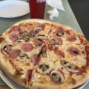 Small pizza with mushrooms and Canadian bacon
