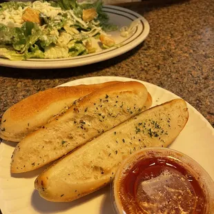 a plate of bread and a salad