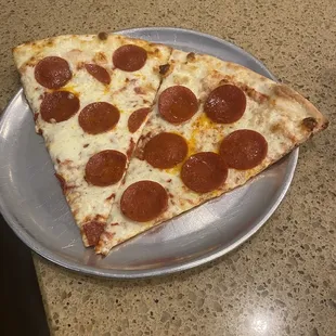a slice of pepperoni pizza