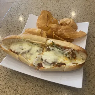 a sub sandwich and chips