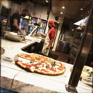 Caprese pizza and bread sticks.
