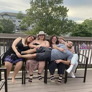 a group of people sitting on a bench