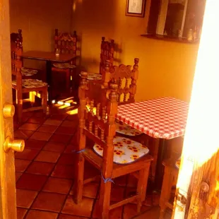 a dining room with a checkered table and chairs