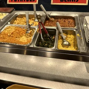 Mac n cheese, greens, corn, beans.. and cheesy potatoes.