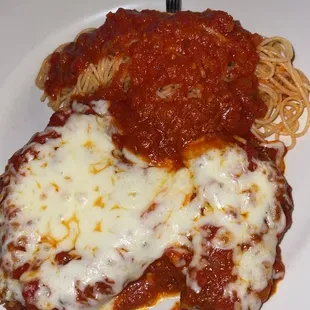 a plate of spaghetti and meat