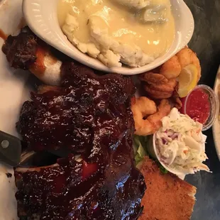 BBQ ribs with shrimp (good sized shrimp!), mashed potatoes and gravy, coleslaw, and cheese bread.
