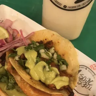 Alpastor and asada cheese taco and drink is the horchata