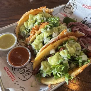 Toasted El Pastor tacos.  House made corn tortilla coated with grilled cheese.  $3.50 each.  Awesome.