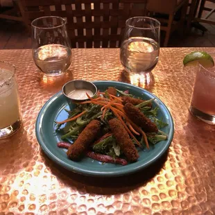 A spicy margarita, berry margarita and chorizo croquettes.