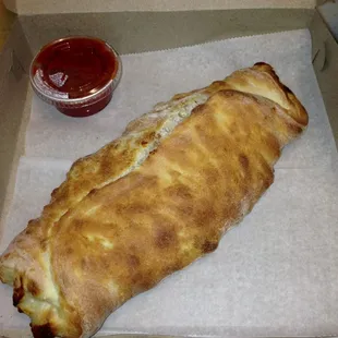 Stromboli. Pepperoni, sausage, mozzarella, little ricotta with a side of tomato sauce.