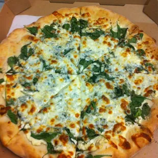 White pizza. Ricotta base (no sauce) with spinach mozzarella and garlic.