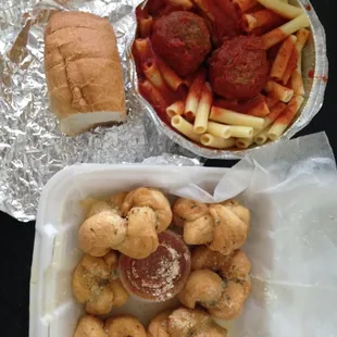 Ziti with two meatballs, garlic knots (6) with sauce, complimentary bread.