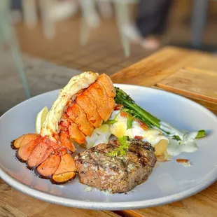 STEAK WITH LOBSTER* 7 oz filet mignon, fully loaded crispy mashed potatoes(incredible), seasonal vegetables.