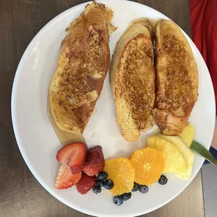 a plate of pancakes and fruit